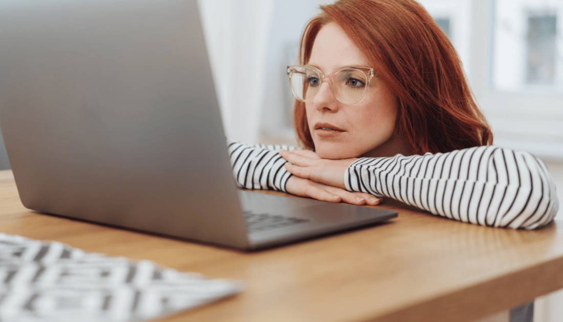 This is a photo of a girl looking at a computer screen.